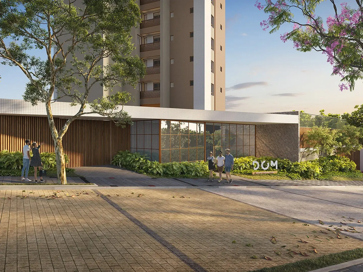 Acesso arborizado de um empreendimento residencial.